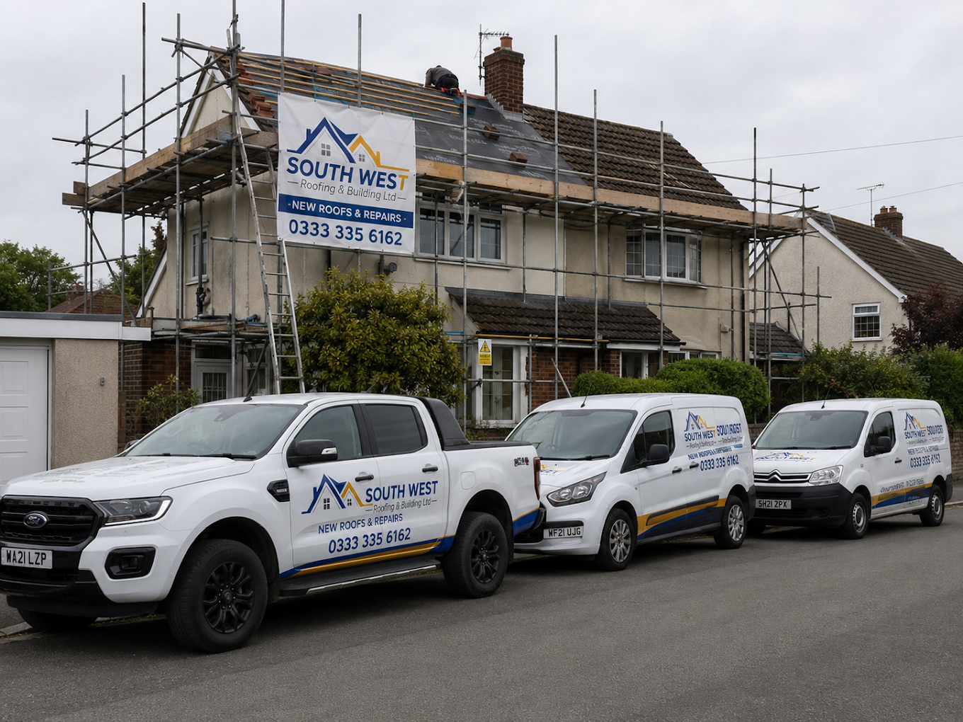South West Roofing & Building vans and scaffolding at a roofing project